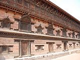 Kathmandu Bhaktapur 03-1 Bhaktapur Durbar Square Palace Of 55 Windows The Palace of 55 Windows in Bhaktapur�s Durbar Square is actually the east wing of the Royal Palace, constructed in the 17C of red brick and featuring 55 black, artfully-carved wooden windows.
